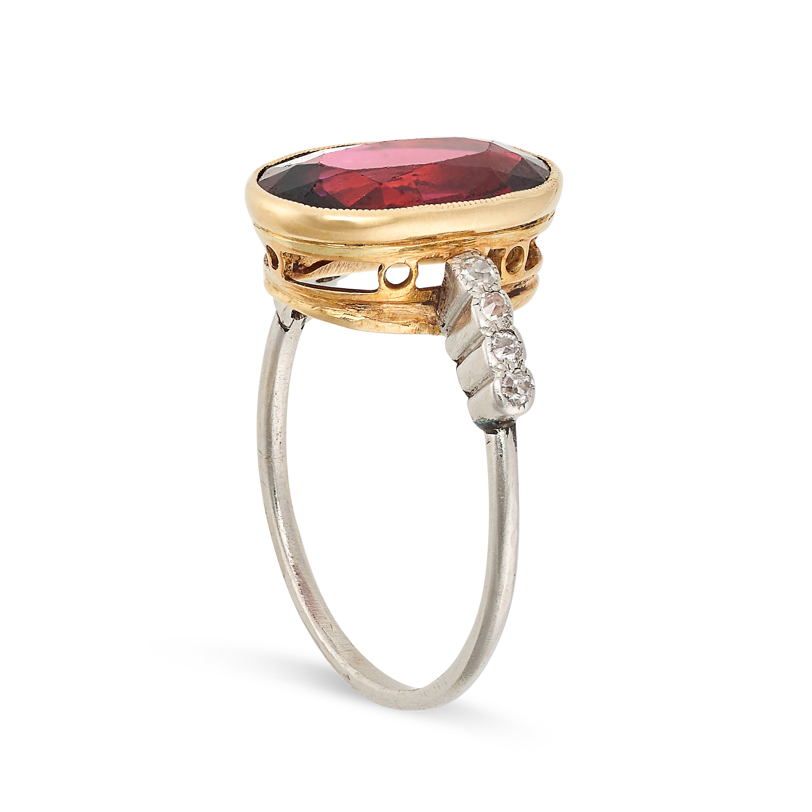 A GARNET AND DIAMOND RING set with an oval cut garnet, the shoulders accented by single cut - Image 2 of 2