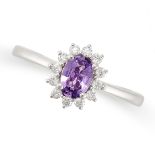 A PINK SAPPHIRE AND DIAMOND CLUSTER RING in 18ct white gold, set with an oval cut pink sapphire in a