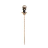 A VINTAGE BLACKAMOOR TIE / STICK PIN in yellow gold, depicting the bust of a man wearing a