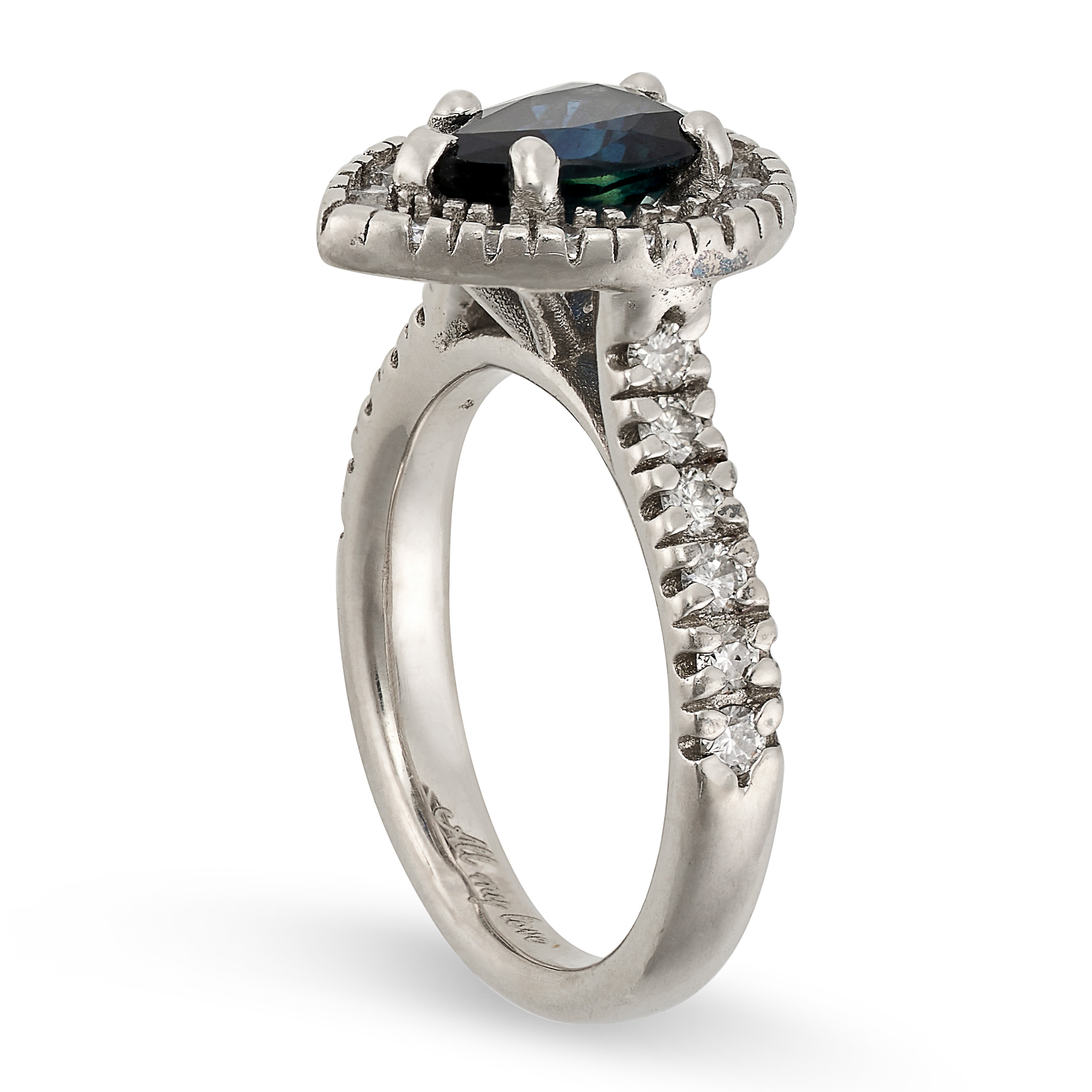 A SAPPHIRE AND DIAMOND RING in platinum, set with a pear cut sapphire in a border of round cut - Image 2 of 2