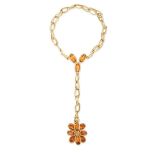 A CITRINE CHAIN RING BRACELET comprising a ring set with a cluster of oval and pear cut citrines and