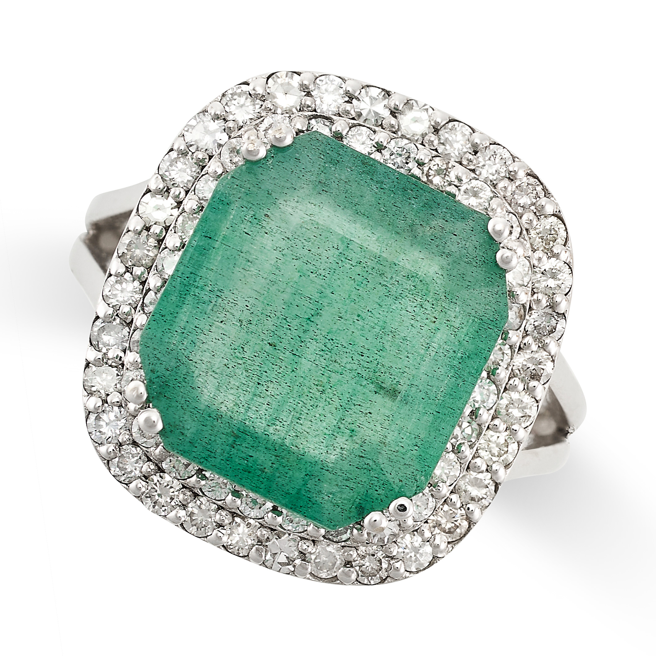 AN EMERALD AND DIAMOND RING set with an octagonal cut emerald, within a double border of round cut