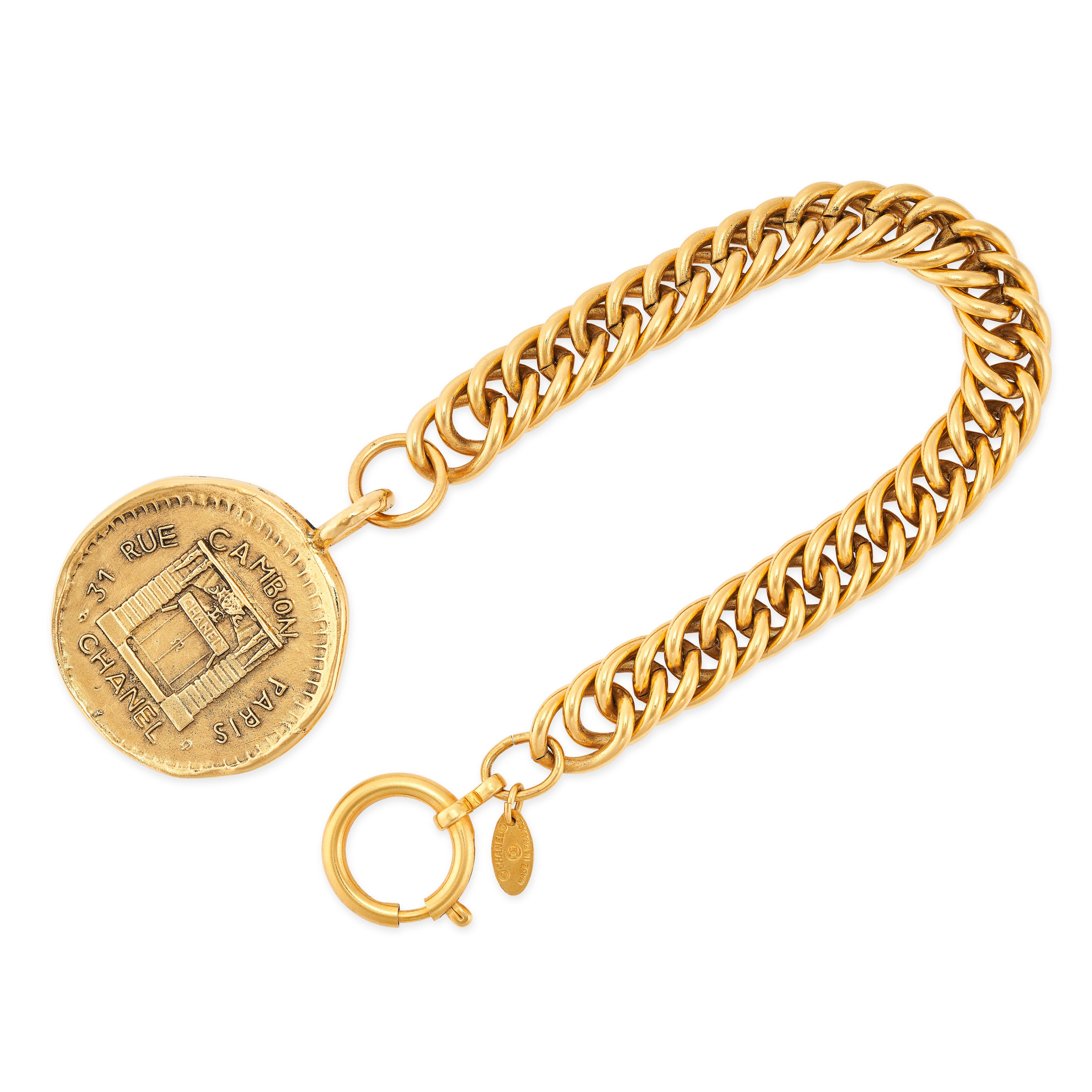 CHANEL, A VINTAGE CHAIN LINK BRACELET WITH PENDANT comprising a fancy link chain with circular