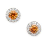 A PAIR OF ORANGE AND WHITE DIAMOND CLUSTER EARRINGS in 18ct white gold, each set with a round