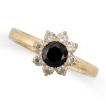 A BLACK DIAMOND AND DIAMOND CLUSTER RING set with a round cut black diamond in a cluster of round