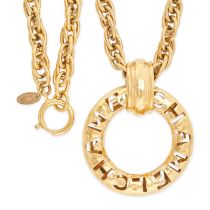 CHANEL, A VINTAGE PENDANT AND CHAIN the circular pendant featuring CHANEL in cut out design,