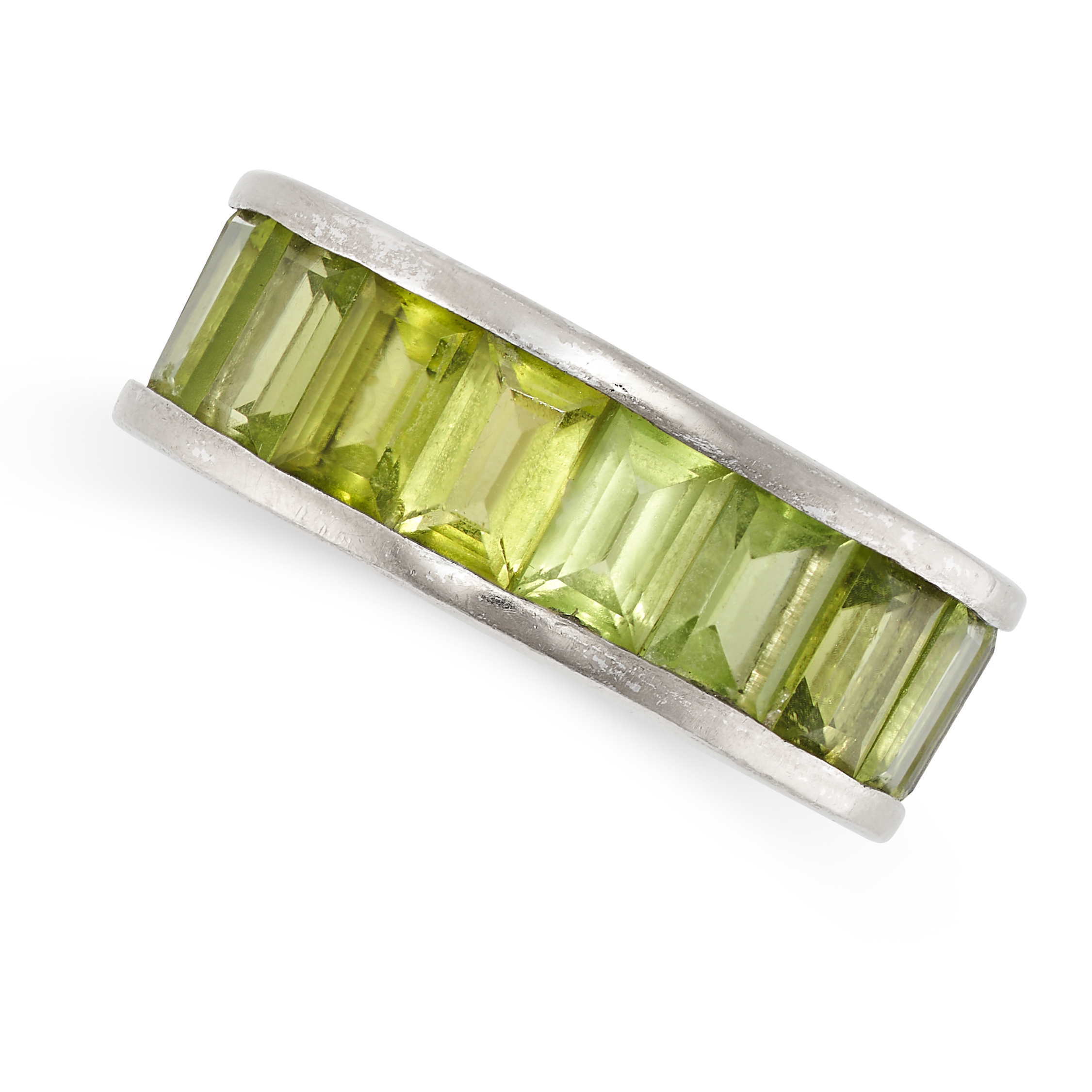 NO RESERVE - A PERIDOT ETERNITY BAND RING in platinum, the band set all around with a single row