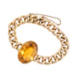 A VINTAGE CITRINE BRACELET in 15ct yellow gold, comprising a row of curb links set with a large oval