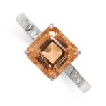 A TOPAZ AND DIAMOND RING set with a central step cut orange topaz accented by single cut diamonds to
