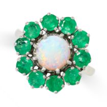 AN OPAL AND EMERALD CLUSTER RING set with a cabochon opal in a cluster of round cut emeralds, no