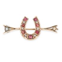 AN ANTIQUE GARNET, RUBY, DIAMOND AND PEARL HORSESHOE BROOCH in yellow gold, comprising a horseshoe