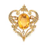 AN EDWARDIAN CITRINE AND SEED PEARL BROOCH / PENDANT in 9ct yellow gold, set with an oval cut