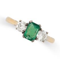 AN EMERALD AND DIAMOND THREE STONE RING in 18ct yellow gold, set with a rectangular step cut emerald