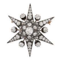 A FINE ANTIQUE DIAMOND STAR BROOCH in yellow gold and silver, designed as a six rayed star, set to