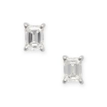 A PAIR OF DIAMOND STUD EARRINGS in 18ct white gold, each set with an emerald cut diamond, the