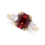 A RUBY AND DIAMOND THREE STONE RING in 18ct yellow gold, set with an emerald cut ruby of 3.37 carats