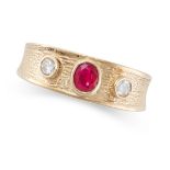 A RUBY AND DIAMOND BAND RING in 9ct yellow gold, set with an oval cut ruby between two round cut
