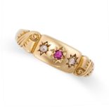 AN ANTIQUE RUBY AND DIAMOND RING in 18ct yellow gold, set with a round cut ruby between two rose cut