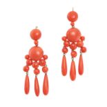 A PAIR OF ANTIQUE CORAL DROP EARRINGS in yellow gold, set with polished coral beads suspending three