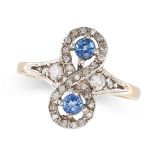 A SAPPHIRE AND DIAMOND RING in 9ct yellow gold, the scrolling face set with two round cut