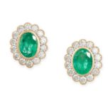 A PAIR OF EMERALD AND DIAMOND CLUSTER EARRINGS in 18ct yellow gold, each set with an oval cut