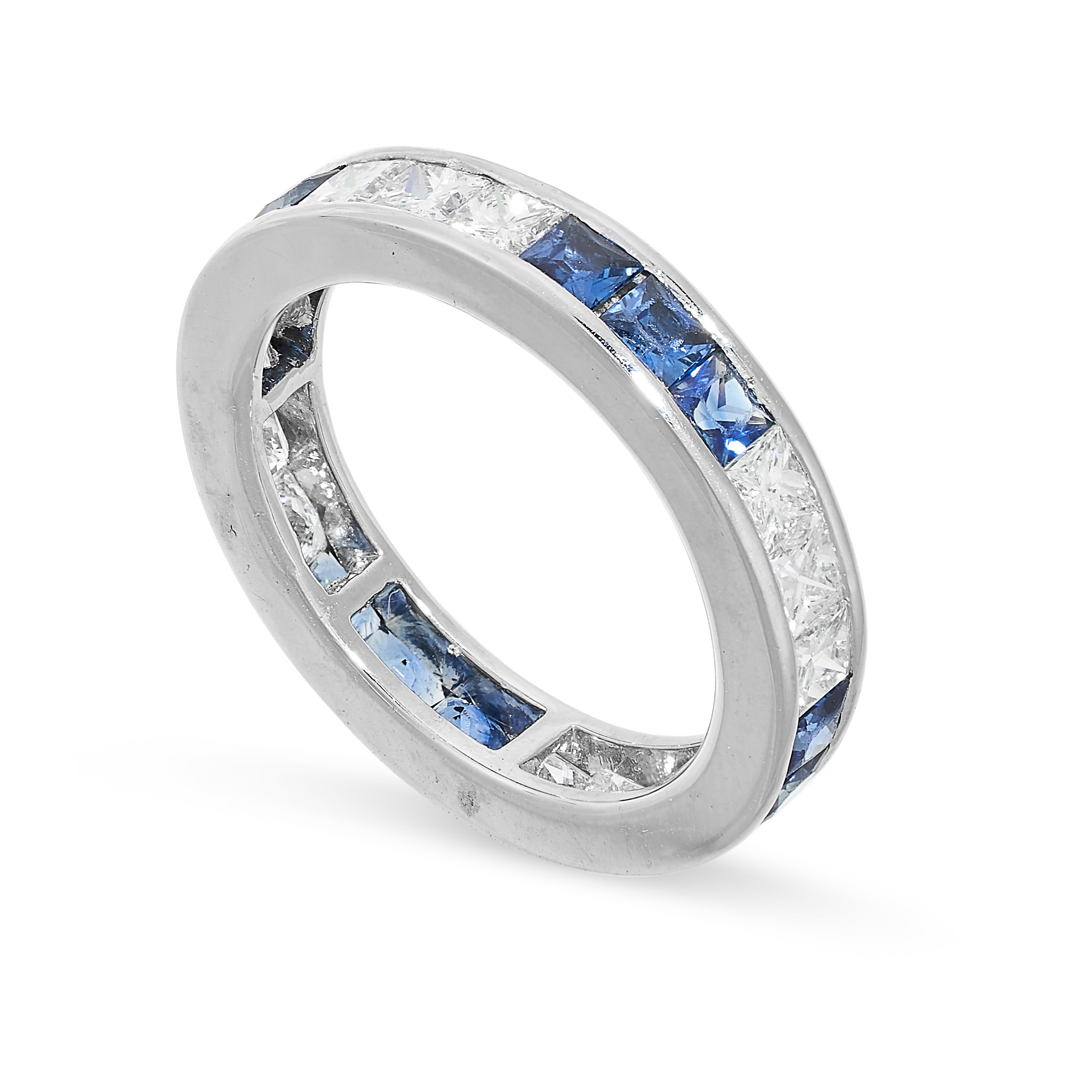 A SAPPHIRE AND DIAMOND ETERNITY RING set with alternating trios of step cut sapphires and princess - Image 2 of 2