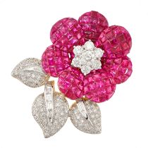 A RUBY AND DIAMOND FLOWER BROOCH set with a central cluster of round brilliant cut diamonds
