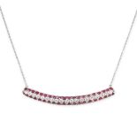 A RUBY AND DIAMOND PENDANT NECKLACE in 18ct white gold, the central panel set with a central row