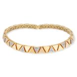 A VINTAGE TRICOLOUR DIAMOND TORQUE COLLAR NECKLACE, 1970S in 18ct gold, with triangular motifs