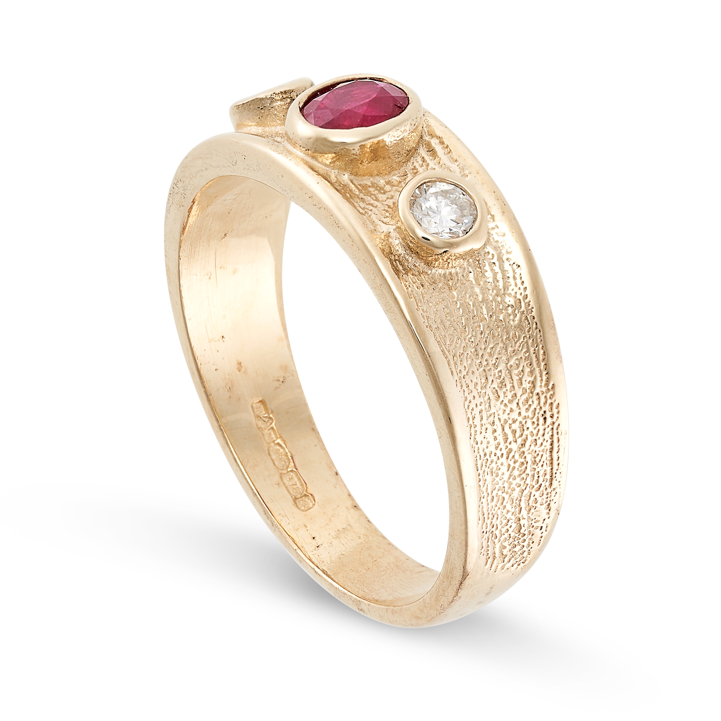 A RUBY AND DIAMOND BAND RING in 9ct yellow gold, set with an oval cut ruby between two round cut - Image 2 of 2