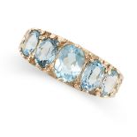 A BLUE TOPAZ FIVE STONE RING in 9ct yellow gold, set with five graduated blue topaz, full British