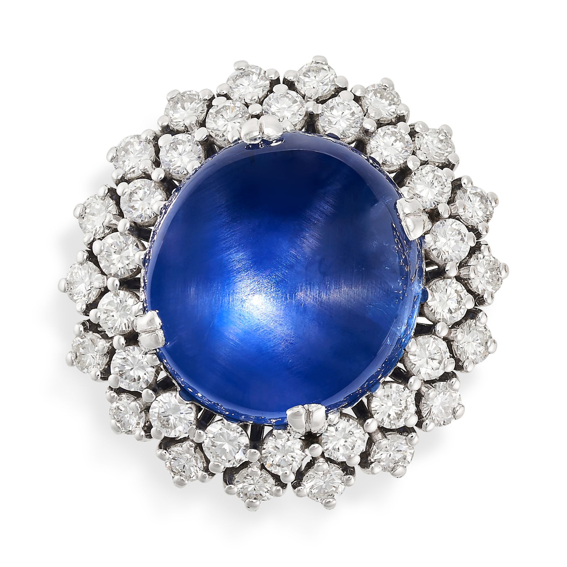 A STAR SAPPHIRE AND DIAMOND CLUSTER RING set with a cabochon star sapphire of 22.0 carats,