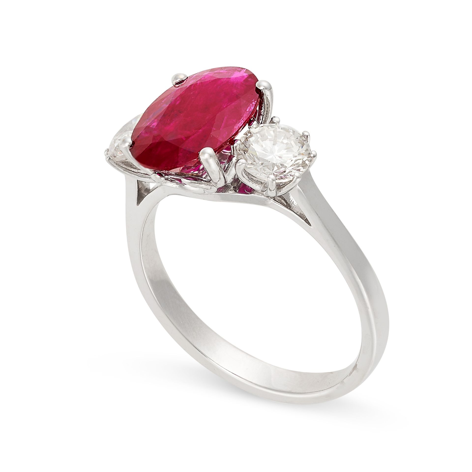 A RUBY AND DIAMOND THREE STONE RING in 18ct white gold, set with an oval cut ruby of 2.41 between - Bild 2 aus 2