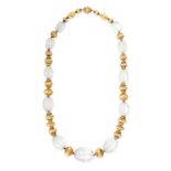 A FINE ANTIQUE CARVED ROCK CRYSTAL NECKLACE in yellow gold, comprising a single row of alternating