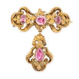 AN ANTIQUE PINK TOPAZ MOURNING LOCKET BROOCH in yellow gold, the scrolling body set with three