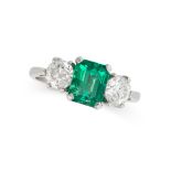 AN EMERALD AND DIAMOND THREE STONE RING in platinum, set with an emerald cut emerald of 1.67 carats,