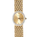 PATEK PHILIPPE, A VINTAGE LADIES DIAMOND WRIST WATCH in 18ct yellow gold and white gold, the oval