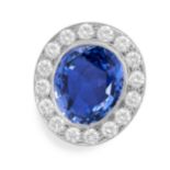 A FINE CEYLON NO HEAT SAPPHIRE AND DIAMOND CLUSTER RING set with an oval cut blue sapphire of 14.