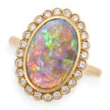 BOODLES, A BLACK OPAL AND DIAMOND DRESS RING in 18ct yellow gold, set with an oval cabochon black