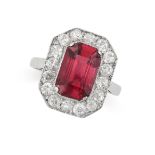 A PINK TOURMALINE AND DIAMOND DRESS RING set with an emerald cut tourmaline of 2.97 carats within