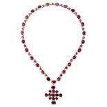 A FINE ANTIQUE VICTORIAN GARNET RIVIERE NECKLACE AND CROSS PENDANT, 19TH CENTURY in yellow gold, the