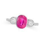 A THREE STONE RUBY AND DIAMOND RING in platinum, set with a cushion cut ruby of 1.95 carats