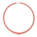 A CORAL BEAD NECKLACE in yellow gold, with a single graduated strand of polished round coral