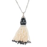 AN ART DECO ONYX, DIAMOND AND PEARL TASSEL PENDANT NECKLACE in platinum and yellow gold, the pendant