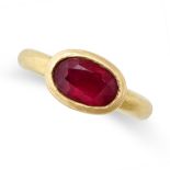 ADRIAN LEWIS, A RUBY ROMAN STYLE RING in high carat yellow gold, set with an oval ruby weighing