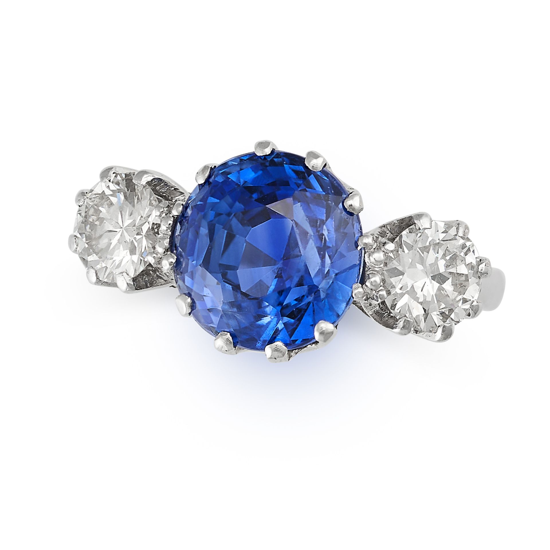 A CEYLON NO HEAT SAPPHIRE AND DIAMOND THREE STONE RING in platinum, set with a cushion cut