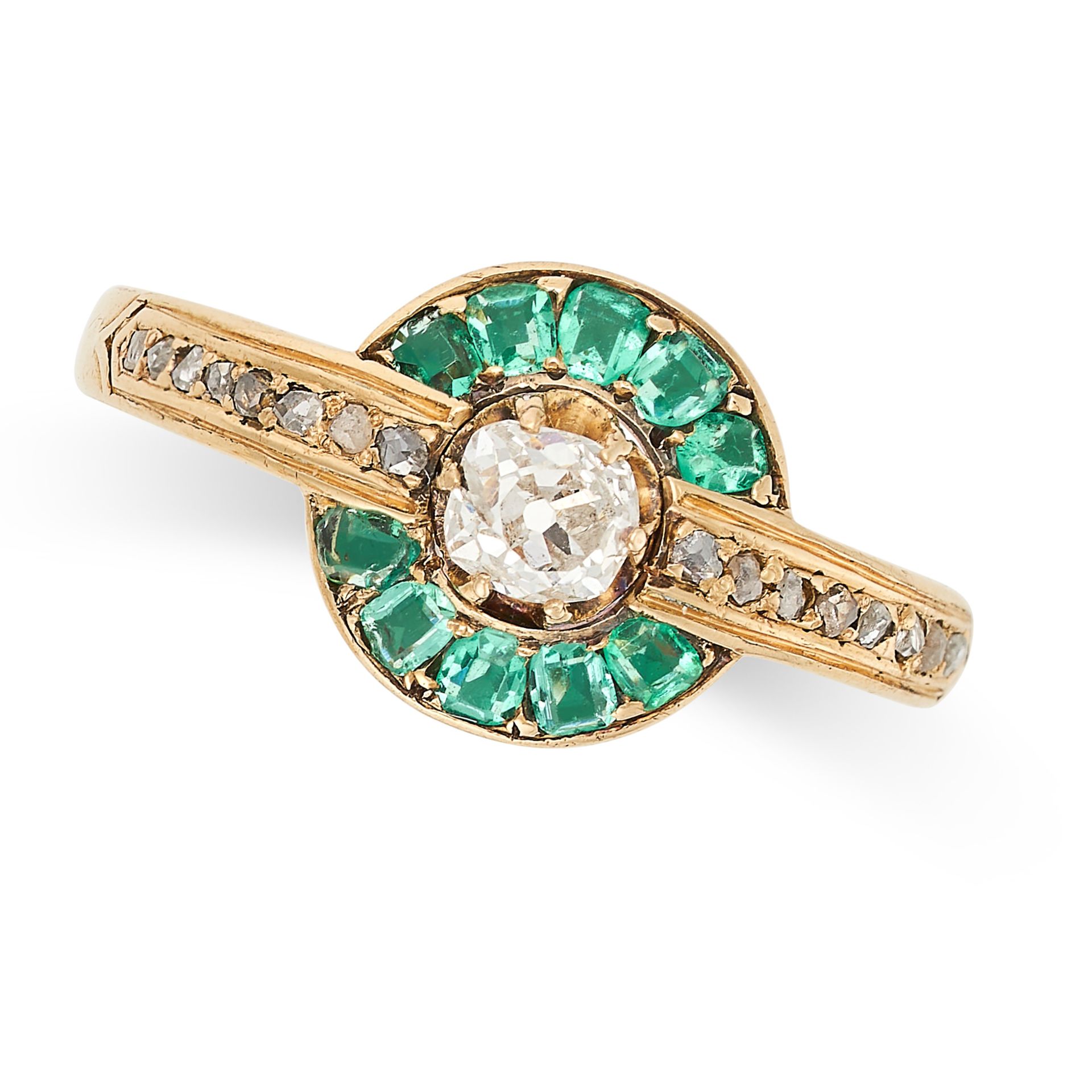 AN EMERALD AND DIAMOND RING set with an old cut diamond in a border of cushion cut emeralds, the