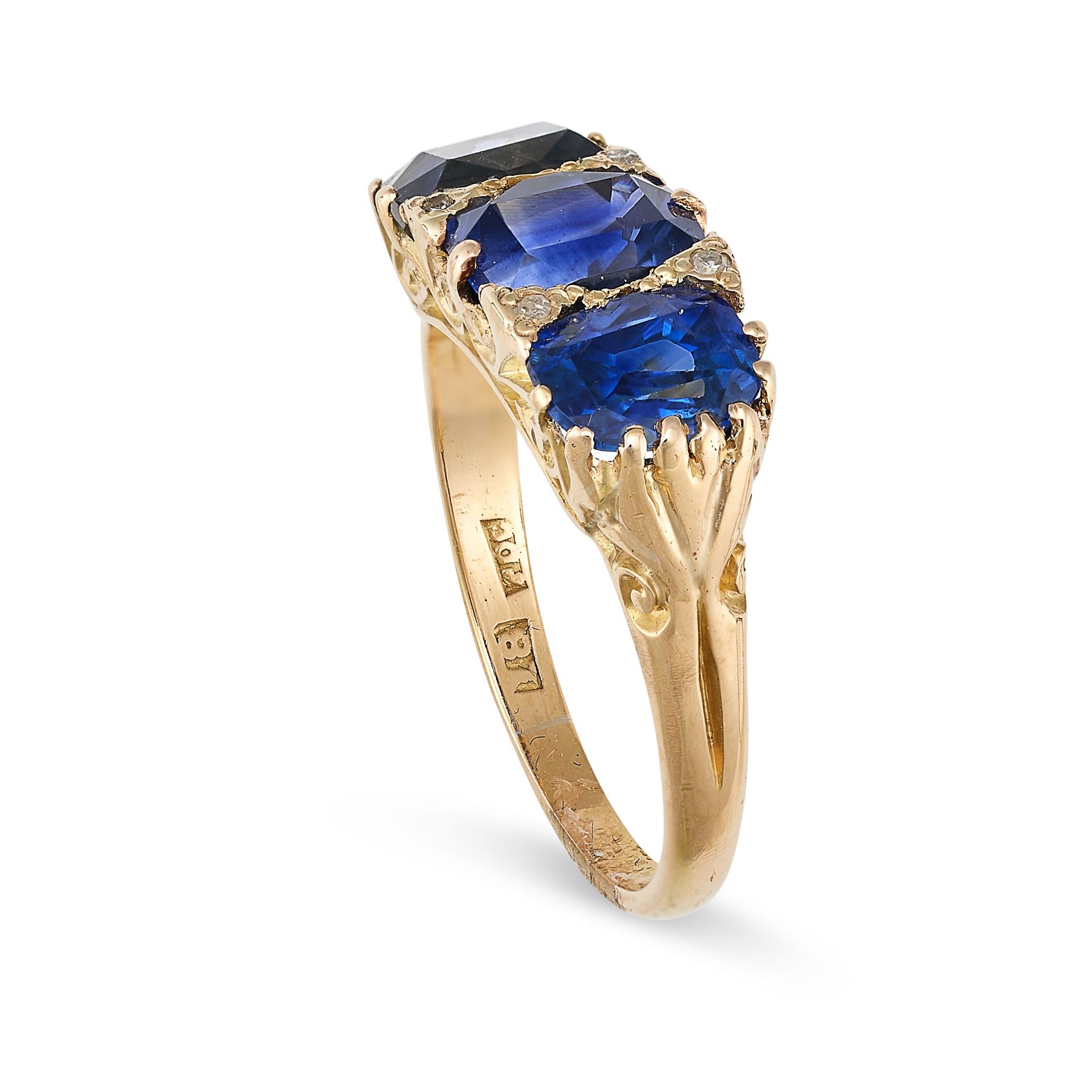 A SAPPHIRE AND DIAMOND DRESS RING in 18ct yellow gold, set with a trio of cushion cut blue - Bild 2 aus 2