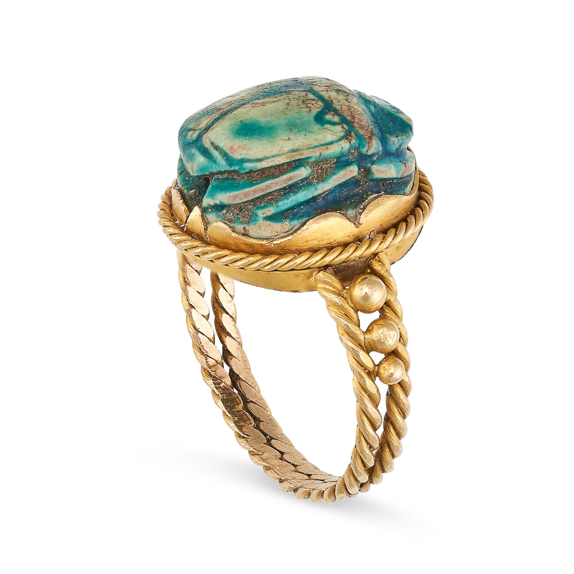 AN EGYPTIAN REVIVAL SCARAB BEETLE RING in yellow gold, the face set with a carved scarab, the band - Image 2 of 2