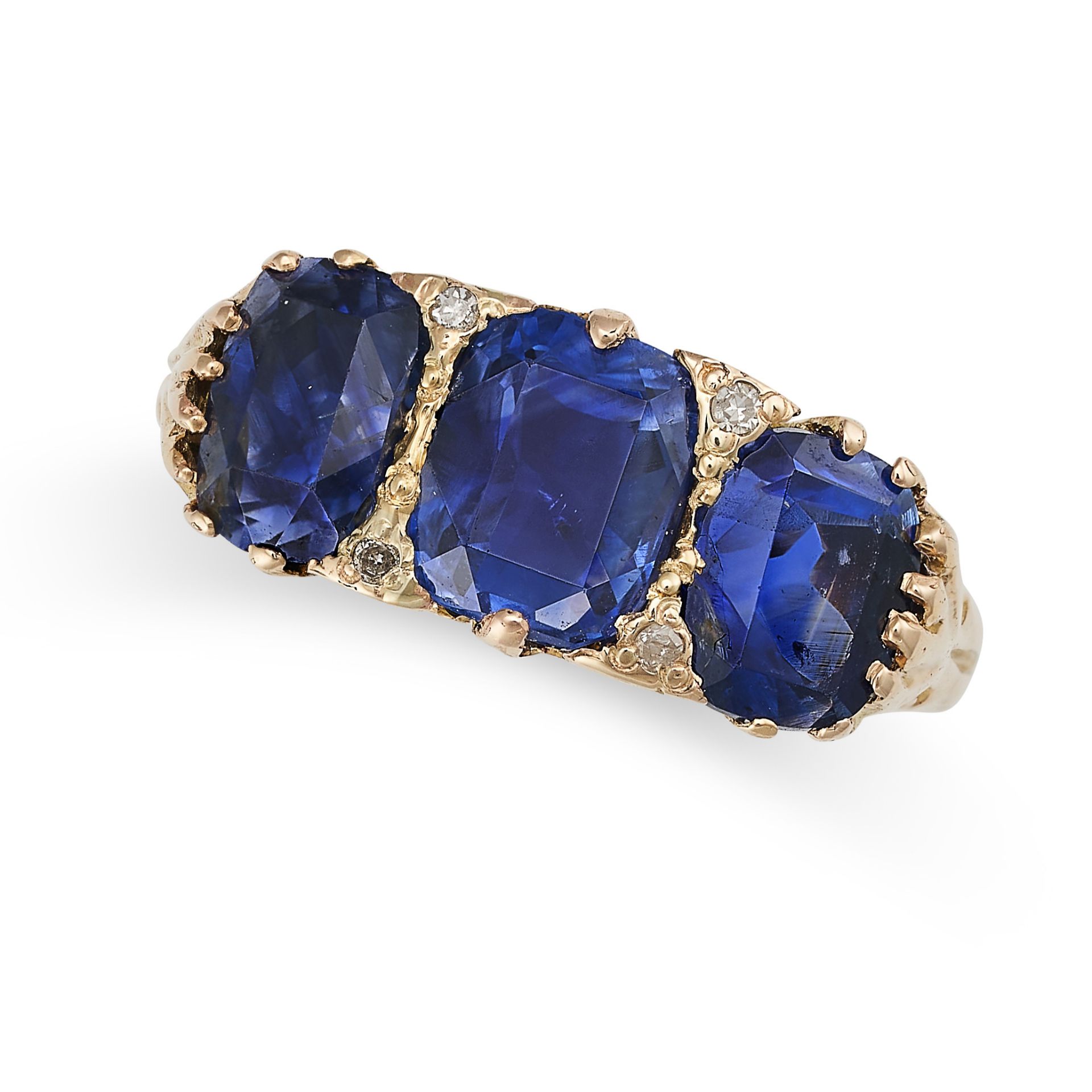 A SAPPHIRE AND DIAMOND DRESS RING in 18ct yellow gold, set with a trio of cushion cut blue